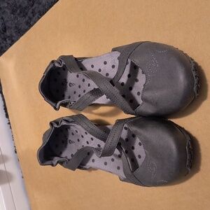 Cute never worn women's size  7.5 vegan leather cross strap flats.  Lightweight